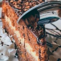 Sasa Cake  · Chocolate cake with layers of orange, amaretto liqueur and a simple vanilla pastry cream.