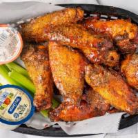 Wings · Our wings are baked and are accompanied by celery and your choice of dressing.