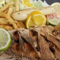 Filete En Crema De Hongos · Tilapia smothered with mushroom sauce and heavy cream. Served with fries, rice, salad and ga...