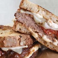 Wild West Melt · Hamburger patty, queso blanco, pepper jack cheese, sauteed jalapenos, red and green bell pep...