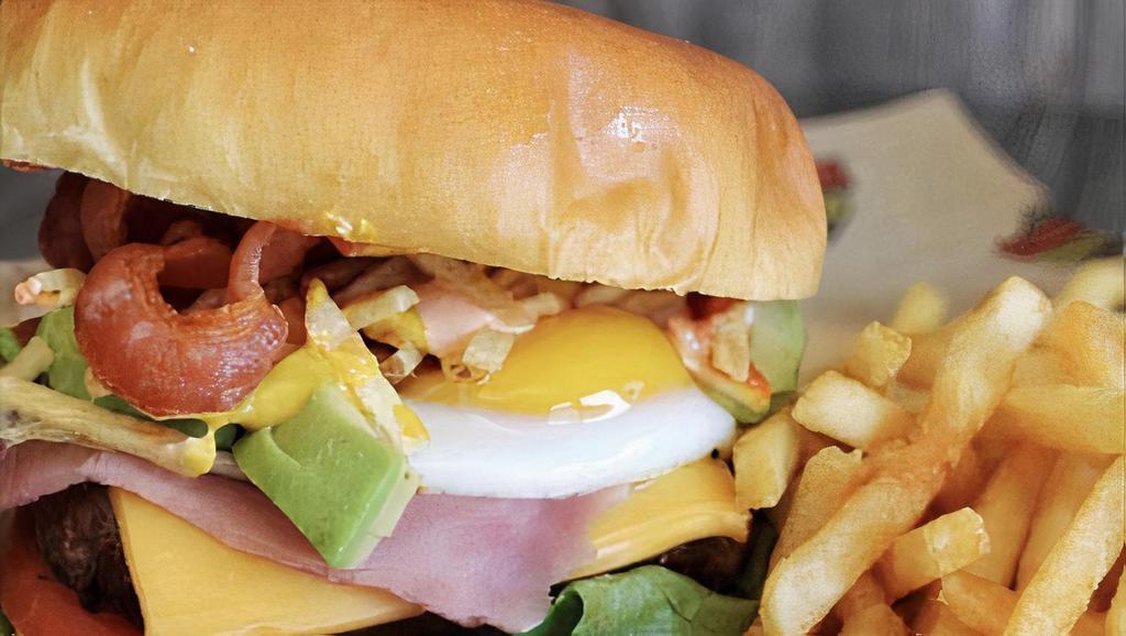 Hamburguesa Budare · Meat or chicken or mixed. American cheese, tomato, lettuce, bacon, fried egg, ham, and sauces.