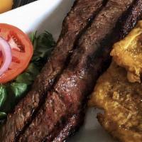 Grilled Steak · Served with two sides.