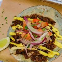 Short Ribs Seco · Short Ribs in cilantro sauce, sweet potato, salsa criolla, cilantro, onion, with huancaina s...