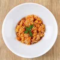 Rigatoni Bolognese · Yummy Nonna’s rigatoni, creamy meat sauce, parsley, and parmesan.