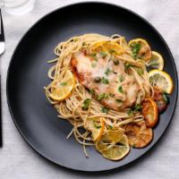Chicken Piccata · Sautéed chicken breast with capers and white wine sauce, served over pasta.