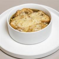 Soupe À L’Oignon · Onion soup, bread, Swiss cheese.