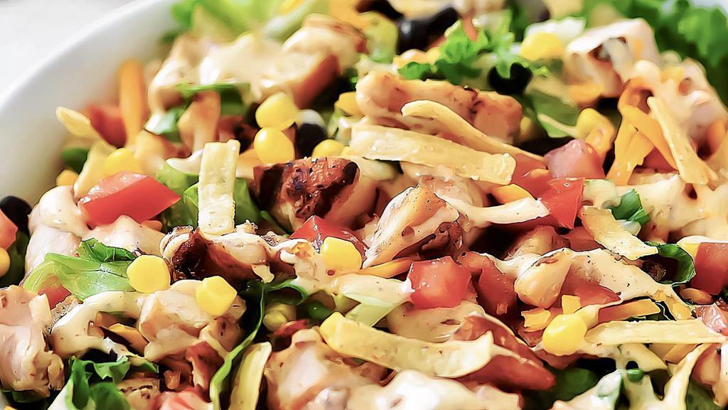 Tex Mex · Romaine, red onions, black beans, tomatoes, corn, Monterey jack and cheddar, and crunchy tortilla strips. Chicken for an additional price. Dressing, chipotle ranch.
