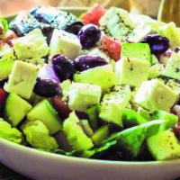 #26 Classic Greek Salad · Feta, tomatoes, cucumber, red onion, green pepper, Kalamata olives, dolmas and fresh bread.