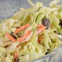 Spicy Coleslaw Salad · Freshly shaved Cabbage, carrots and chives dressed in our homemade Cayenne pepper spicy mayo...