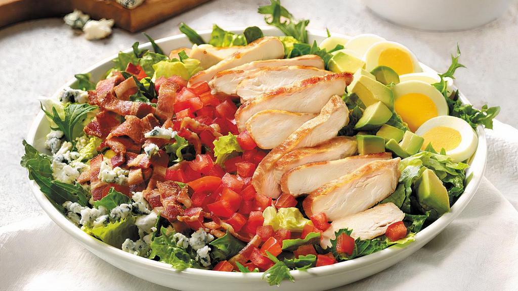 Cobb Salad · Grilled chicken breast, bacon, avocado, hard-boiled egg, tomato, crumbled Bleu cheese on mixed greens with your choice of dressing. (Serves 4)