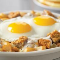 Chicken-Fried Steak Skillet* · Savory chicken-fried steak and onions topped with country sausage gravy.
