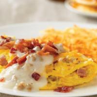 Country Music Star Omelette* · House-made sausage, diced ham and onions, topped with Cheddar and Monterey Jack cheeses, cou...