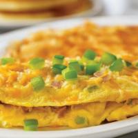 Denver Omelette* · Diced ham, fresh green peppers and onions, topped with melted cheese.
