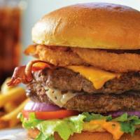 All-World Double Cheeseburger®* · Layers of American and Swiss cheeses on two juicy burger patties topped with two cherrywood-...
