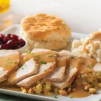 Slow-Roasted Turkey · Hand-carved and served with cornbread stuffing, mashed potatoes and turkey gravy, cranberry ...