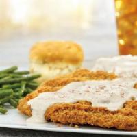 1/2-Lb. Chicken-Fried Steak · Smothered in country sausage gravy, served with mashed potatoes and gravy and a buttermilk b...
