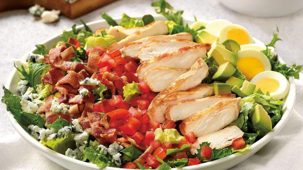 Classy Cobb Salad · Grilled chicken breast, bacon, avocado, hard-boiled egg, tomato, and crumbled Bleu cheese on mixed greens.