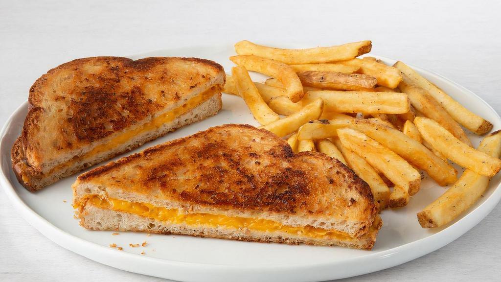 Grilled Cheese · Grilled cheese sandwich with melted American cheese.