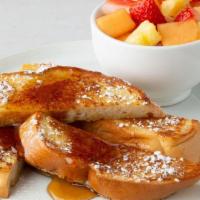 French Toast · Grilled French toast sprinkled with powdered sugar, served with syrup.