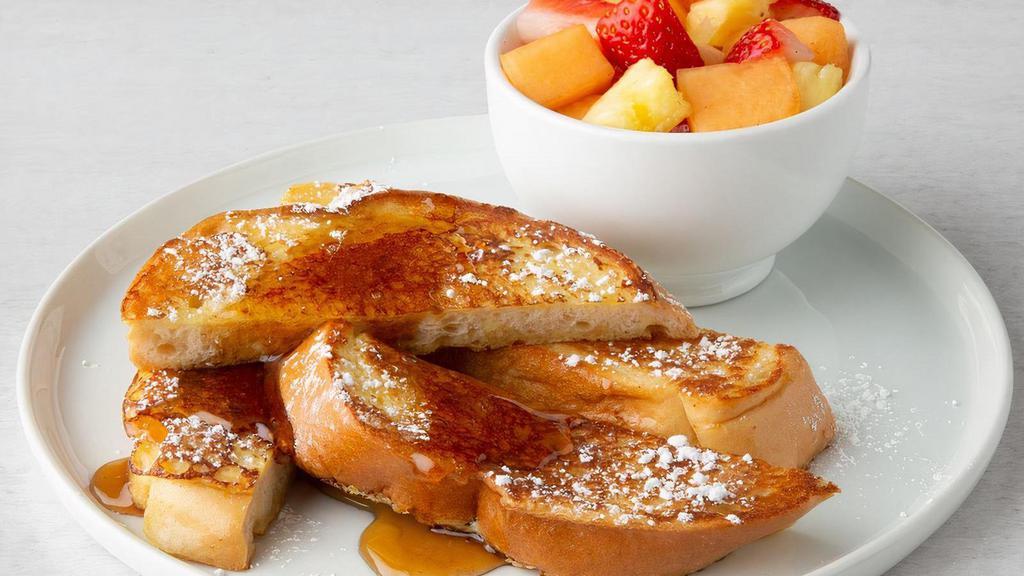 French Toast · Grilled French toast sprinkled with powdered sugar, served with syrup.