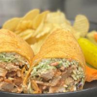 Buffalo Chicken Wrap · Fried chicken, Texas Pete and broccoli slaw with bleu cheese dressing.  Served with chips an...
