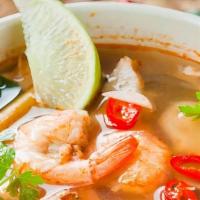 Tom Yum Soup · Lemongrass soup with lime juice and straw mushrooms.