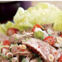 Beef Salad · Marinated grilled beef with cucumber slices, onions, tomatoes, cilantro, and fresh chili lim...