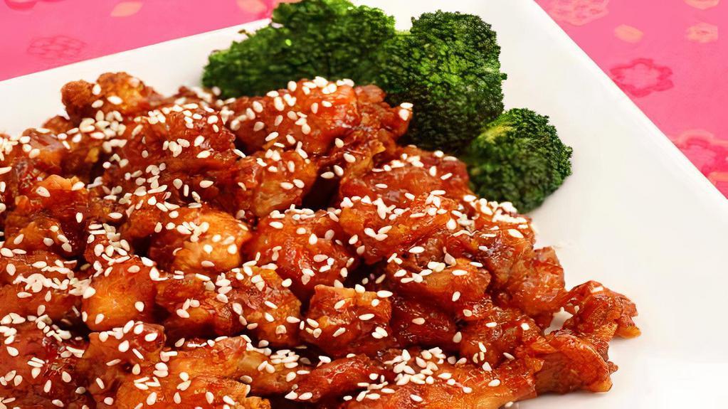 Sesame Chicken · Deep fried white meat chicken with honey glaze sesame sauce and steamed vegetable.