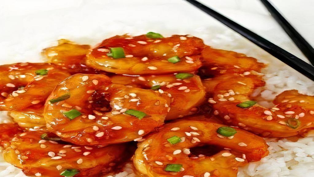 Sesame Shrimp · Deep fried shrimp with honey glaze sesame sauce and steamed vegetable. Comes with egg fried rice.