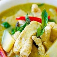 Green Curry · Bell peppers, bamboo shoots, green beans, eggplant, and fresh basil leaves.