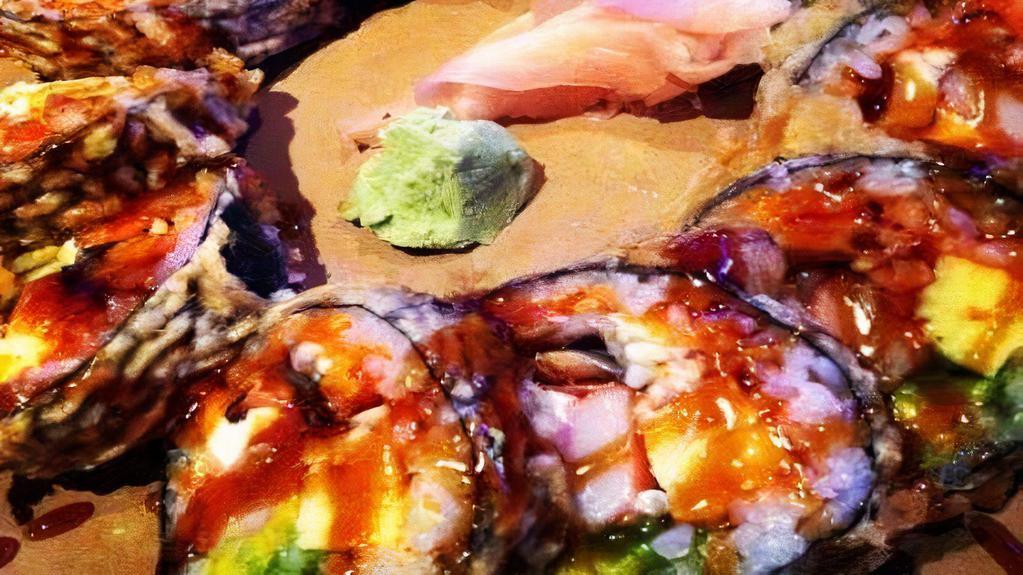 Optimistic Roll · Flash fried salmon,  crab meat, cream cheese, avocado, tamago, jalapeño, and hot sauce.