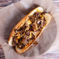 Beef Philly Cheesesteak · Juicy chopped steak, grilled onions and peppers and melty cheese on a toasted hoagie roll.