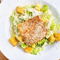 Grilled Mahi Caesar Salad · Grilled mahi fillet over our classic Caesar salad topped with parmesan cheese and croutons