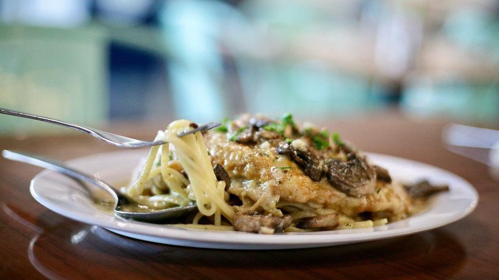 Corvina Français · Corvina fillet dusted in flour, dipped in egg wash, and prepared in a light lemon sauce, served over linguine.