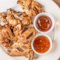 Chicken Wings · Six pieces of bone-in wings. Served with your choice of sauce.