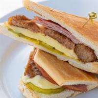 Croqueta Preparada Sandwich / Croqueta · Ham Croquettes, melted Swiss cheese, ham, mustard & pickles on toasted Cuban bread