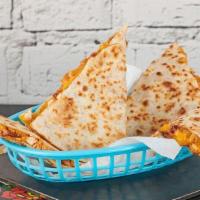 Pulled Beef Barbacoa Quesadilla · Pulled beef barbacoa with shredded cheese, queso, and your choice of sauce.
