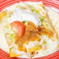 Enchilada Plate · Three cheese and onion enchiladas topped with an egg served with beans and rice.