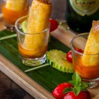 Spring Rolls (4) · Homemade crispy rolls stuffed with carrots, cabbage, glass noodles, and Thai herbs. Served w...