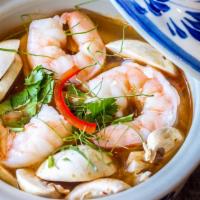 Tom Yum Soup · Cherry tomato, mushrooms, and cilantro in lime-lemongrass soup. A little sour and a little s...
