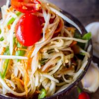 Papaya Salad · Traditional Thai green papaya with green beans, tomatoes, and ground peanuts in lime juice p...