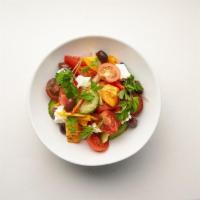 Greek Tomato Salad · Heirloom tomatoes, peppers, cucumber, red & white onions, feta, Greek olives.
