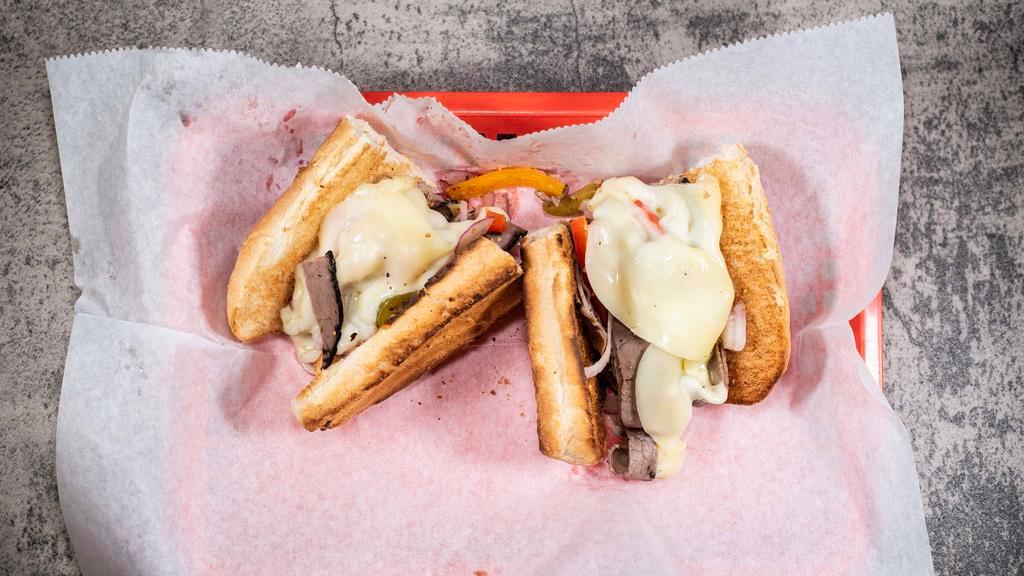 Philly · Roast Beef, onions, grilled peppers and provolone cheese served on a warm toasted sub roll.