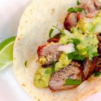 Carnitas · Pork butt cooked low and slow and topped with taco shop guac and homemade pico de gallo.