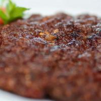 Chapli Kabab · Grilled minced chicken of beef with herbs and spices patties. Served with naan or rice.