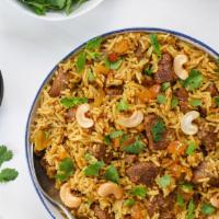 Lamb Biryani · Long grain basmati rice cooked with lamb to perfection over a low flame. Garnished with cris...