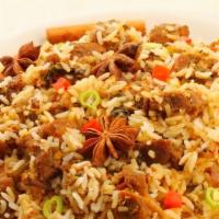 Goat Biryani · Long grain basmati rice cooked with a goat to perfection over a low flame. Garnished with cr...