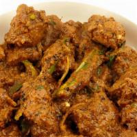 Achari Gosht · Tender meat on the bone cooked in a pickling sour sauce with spices.