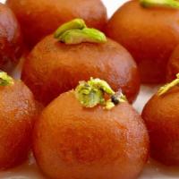 Gulab Jamon · Fried cheesy dumplings dipped in saffron flavored sugar and honey syrup.