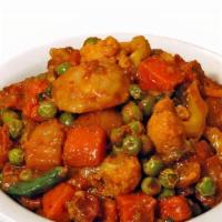 Mix Veg · Medley of vegetables cooked in onion, tomatoes, and bell peppers with curry sauce.